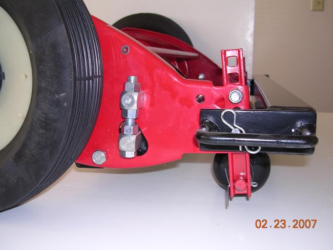 (G) Attach to Power Unit. Tongue top surface should be nearly level when attached to power unit. A Attach reel to frame as shown (Figure 1) and (Figure 2).
