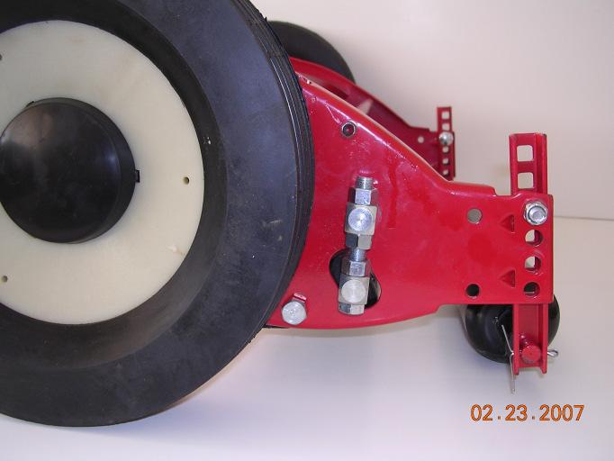 Do not operate mower with loose bolts Figure 1 Figure 2 ROLLER BRACKET ADJUSTING NUT AXLE BOLT Roller brackets, Figure 2, are intended to level mower.