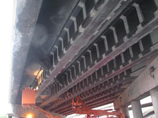 The first repair work was an emergency deck soffit repair and massive transverse diaphragms were constructed between girders.
