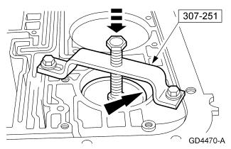 Page 7 of 20 21. Using the special tool, compress the overdrive servo assembly and install the overdrive servo retaining ring. 22. Install the intermediate clutch pressure plate. 23.