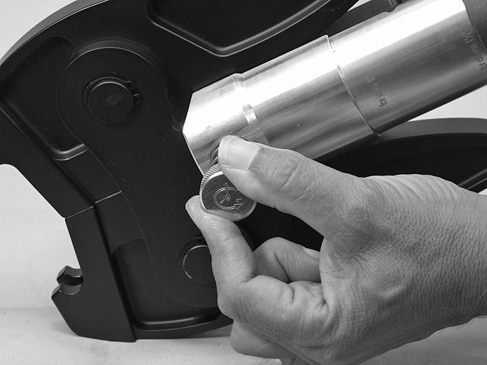 Push the locking pin fully into the tool until it clicks.
