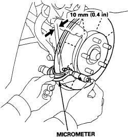 and measure rotor with a dial indicator and a