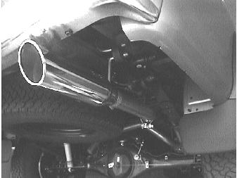 Place the muffler assembly into position as shown in figure 3 using the original clamp and install hangers into rubber brackets. 2.