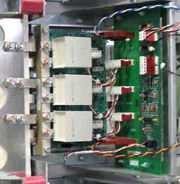 Remove the Output Busbar at the Current Transducer: a. Remove and save the torx head bolt that secures the Output Busbar to the AC Output Busbar. b. Remove and save the two hex head bolts that secure the Output Busbar to the U, V or W Busbar.