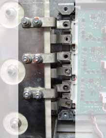 The negative (DC-) Flexible Capacitor Busbars have a higher angle. 6. Install the Tie Down Capacitor Mount: a.
