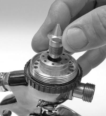 4. Place the Air Distributor onto the body of the spray gun aligning the pin with the hole in the spray