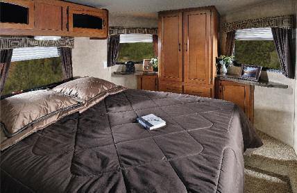 The bed must tuck up, into the front of the cap. Our V-Design allows for a full height front bedroom!