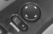Power Remote Control Mirror Your vehicle has an electric mirror control located on the driver s door armrest. Move the switch below the control to choose the right or left mirror.