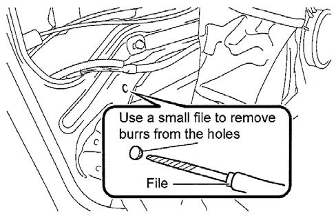 12) Using a small round file, remove the burrs from the drilled hole. 13) Remove the cloth tape. 14) Remove the piece of cloth, making sure not to spill the filings inside the door.