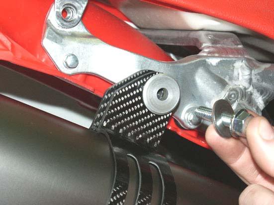 Attach the carbon-fiber clamp to the stock chassis hanging bracket using