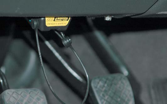 Install the OBDII cover on the port and secure the attached cord around the wiring harness behind the port.