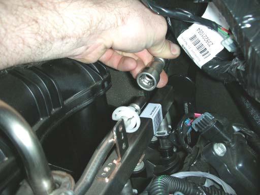 30. Remove the stainless steel safety clip from the fuel line. Do not discard.