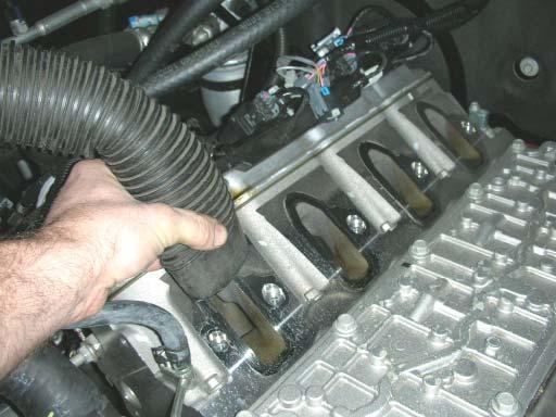 Take care not to drop any bolts, dirt or any debris into the intake ports. 38.