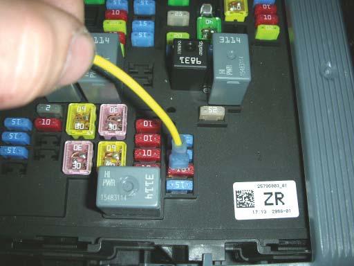 With the relay mounted, take the yellow trigger wire from the relay, strip about ¼ of the