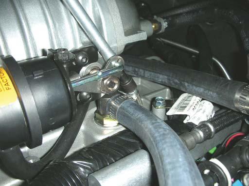 145. Starting at the intercooler barb on the driver side of the supercharger, cut off the molded elbow at the short end