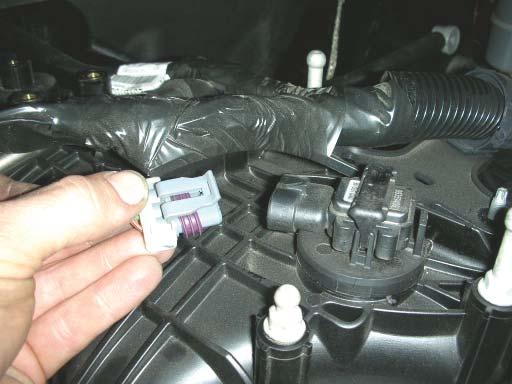Unplug the eight fuel injector plugs by pulling up on the