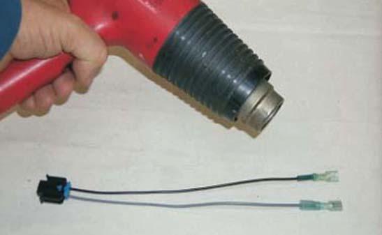 33. On one end of the pump harness, cut the wires 1 from the plug and strip the insulation back 1/4.