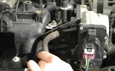 Remove the PCV vent hose from the throttle body or intake manifold on the passenger side