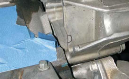 The new manifold should not touch the alternator mount. These modifi cations can be easily done with the mount in place.