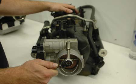 120. Using a 10mm socket wrench remove the stock throttle body from the stock intake