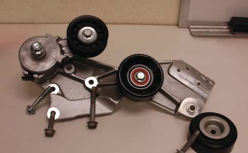 Here are the new tensioner support bracket and associated