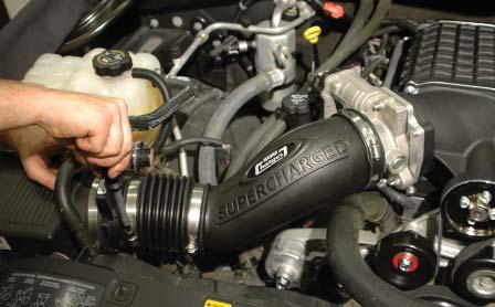 Attach the hose between the right (passenger) side valve cover hose barb near