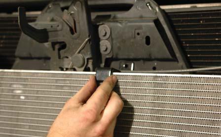 212. Press the adhesive backed rubber U channel from step #209 onto the top of the heat exchanger to align the bolt hole