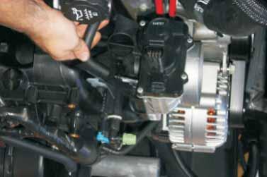 48. Remove the (PCV) vent hose from the throttle body or intake