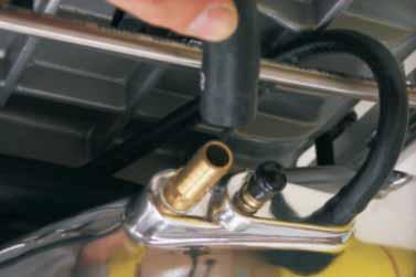 Remove the stock fuel pressure regulator from the fuel rail by disconnecting the