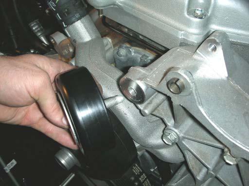 73. Re-installed the alternator/power steering bracket with all the factory hardware and torque to