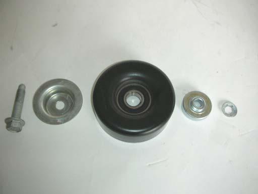 The bolt retainer and stand-off (pictured here on the right side of the pulley), will not be re-used.