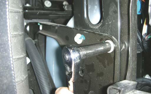 133. Using a 10mm socket wrench, remove the bolts shown, this is behind the drivers side