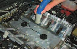 engine valley cover area. 63. Cover the intake ports with tape or clean rags 64.