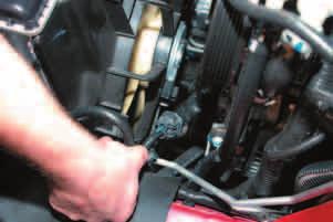 Disconnect the radiator fan electrical connections on each fan by squeezing the