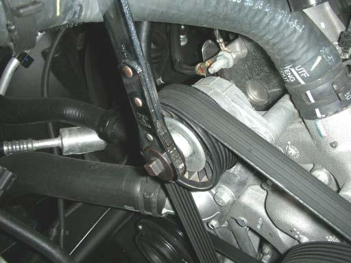 33. Remove the stock belt using a 15mm belt tensioner wrench on the tensioner pulley.