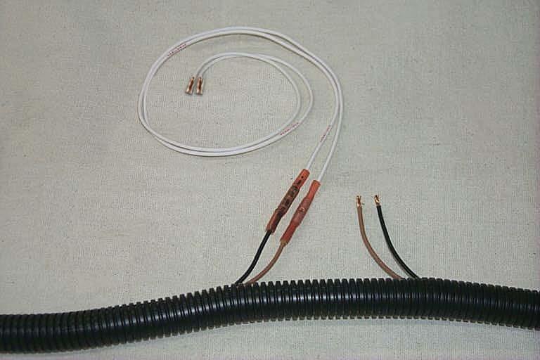 70. Cut the supplied white wire into two equal lengths and strip about ¼ off all ends.