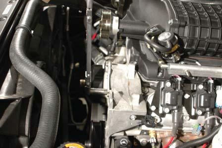 Locate the two IAT white wires on the driver side of the intercooler lid.