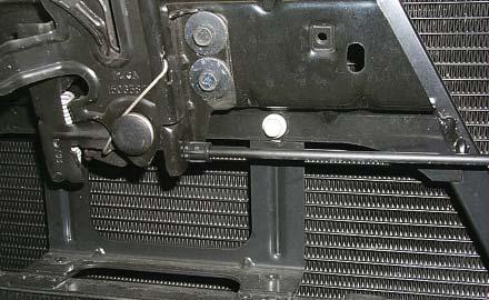 146. Remove the bolt located below and to the right of the hood
