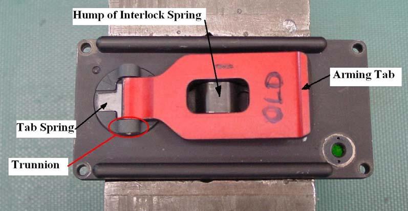 Figure 1. Diagram of the hump of interlock height. 5. We rotated the arming tab 180 and then put it back to the down against the lid position. 6.