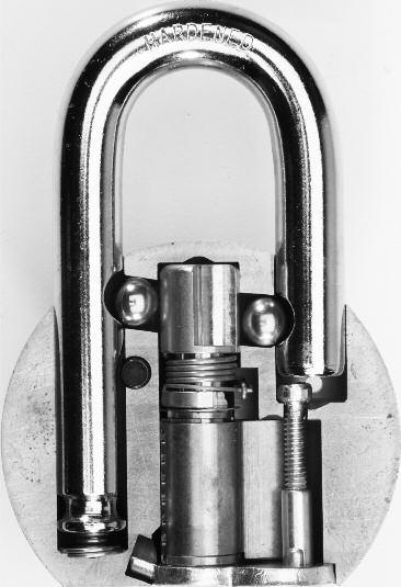 American Lock Series A700 Disassembly Unlock shackle Use a Phillips screwdriver to remove security screw Remove security nut and trap door Remove cylinder and anti-bypass plate Place lock on flat