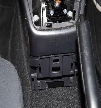 Safety Recall S61 -- Occupant Restraint Controller Page 18 10. Remove the two rear screws and remove the front console shifter housing (Figure 22).