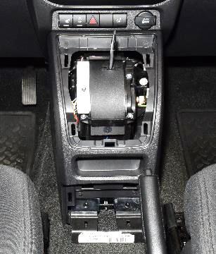 Using trim stick C-4755 or equivalent, pry up on the shifter boot and separate from the bezel, if equipped with a manual transmission. BEZEL c.