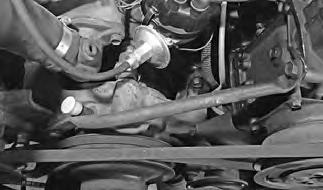 If equipped, separate the power steering pump from the power steering pump bracket by removing (4) nuts ((3) on