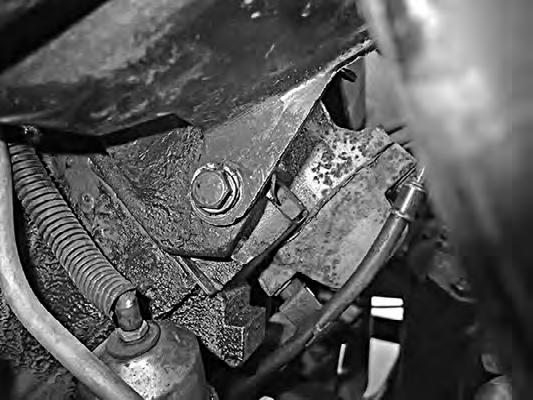 Remove the power steering pump bracket by removing the bolt that secures it to the head (See