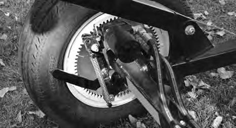 The assembly is designed to pivot to allow the operator to move the sprocket into the toothed
