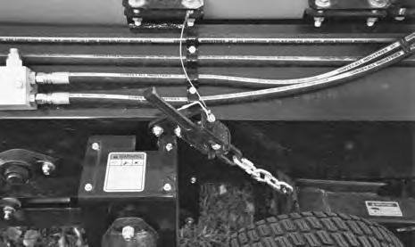 5. If equipped with lights or an optional lighting package, connect wiring harness to the towing vehicle and secure across