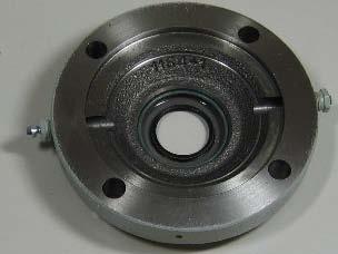 The bearing housing may be removed with one or two screwdrivers using the groove
