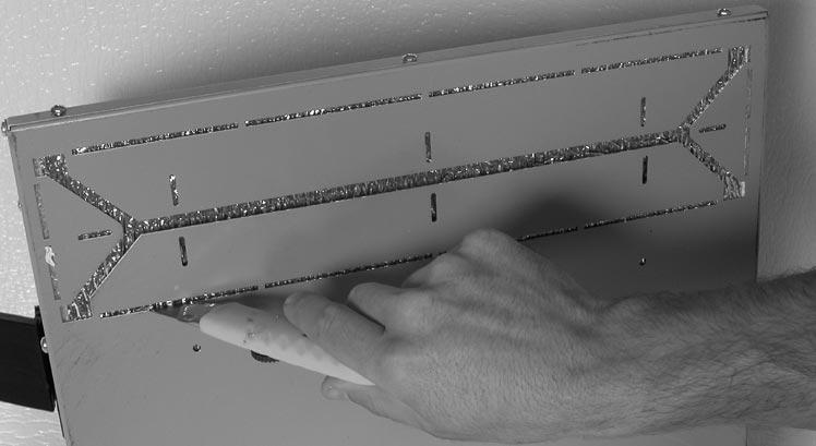 Step 2: Preparing ducting flairs Remove the door and filters and proceed to cut the insulation as illustrated below.