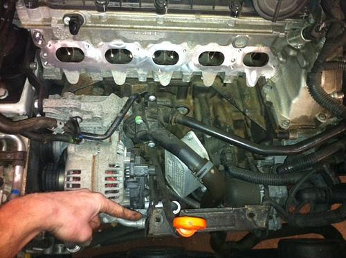 Step 9: Remove all bolts from intake manifold. The center-bottom bolt requires a VERY thin allen socket and long extension. Save all bolts as you will reuse them.