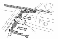 Verify the cables do not block the rear heater duct. 9. Reinstall the carpet felt and verify the base bracket bolt positions.